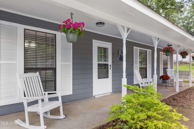 doorway to property with a porch
