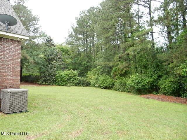8 Auburn Ln, Hattiesburg, MS 39401 - view of grassy yard featuring central air condition unit
