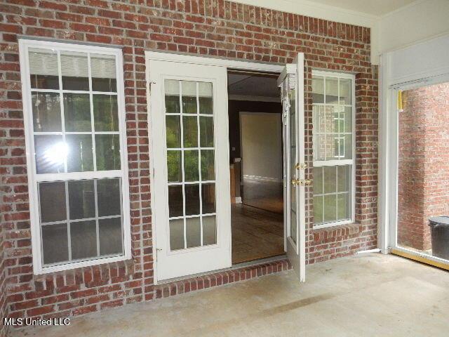 8 Auburn Ln, Hattiesburg, MS 39401 - doorway to property featuring brick siding