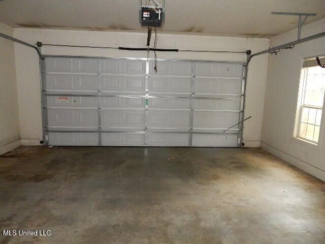 8 Auburn Ln, Hattiesburg, MS 39401 - garage featuring a garage door opener