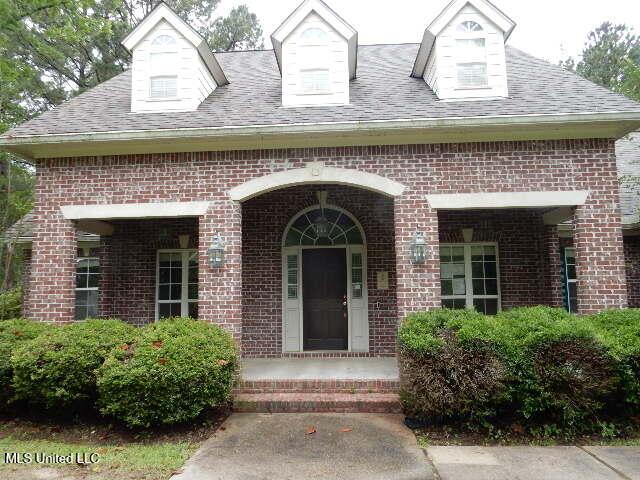 8 Auburn Ln, Hattiesburg, MS 39401 - entrance to property with brick siding and a shingled roof
