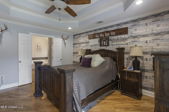 408 Abbey Woods, Brandon, MS 39047 - bedroom with a raised ceiling, an accent wall, baseboards, recessed lighting, and wood finished floors