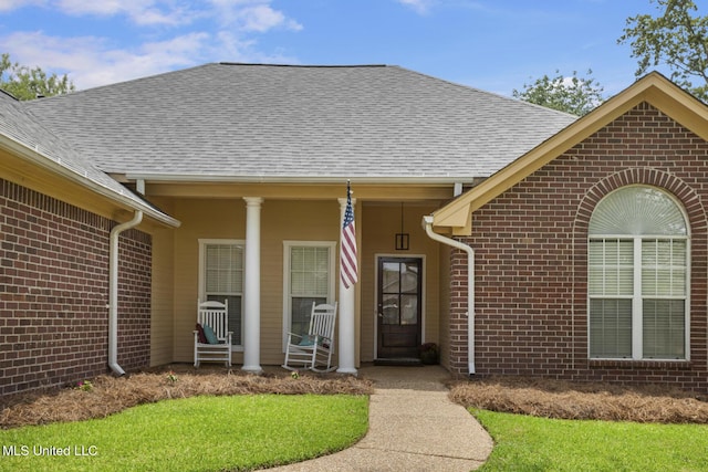 408 Abbey Woods, Brandon, MS 39047 - view of exterior entry with brick siding and roof with shingles