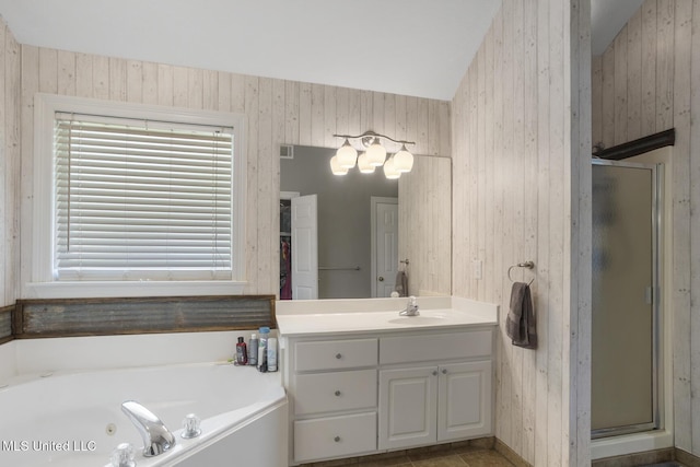 408 Abbey Woods, Brandon, MS 39047 - bathroom featuring a stall shower, vanity, a tub with jets, and wooden walls