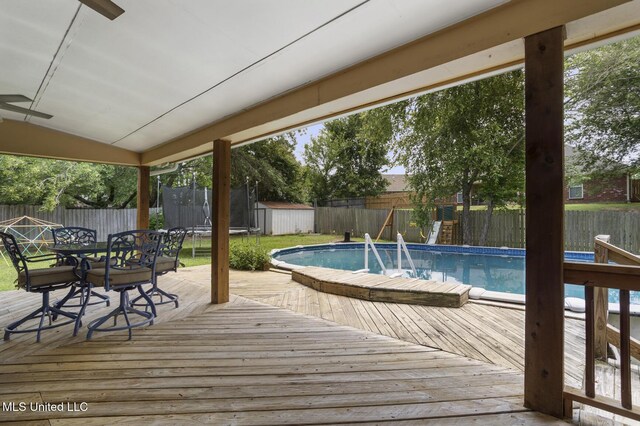 408 Abbey Woods, Brandon, MS 39047 - view of swimming pool with a fenced backyard and a wooden deck