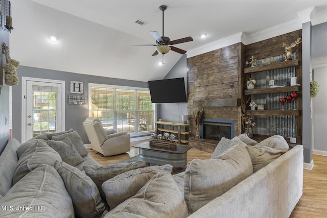 408 Abbey Woods, Brandon, MS 39047 - living room featuring a ceiling fan, a stone fireplace, vaulted ceiling, light wood-style flooring, and baseboards