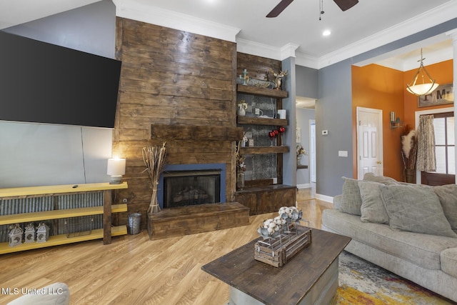 408 Abbey Woods, Brandon, MS 39047 - living room featuring ceiling fan, wood finished floors, crown molding, a stone fireplace, and baseboards
