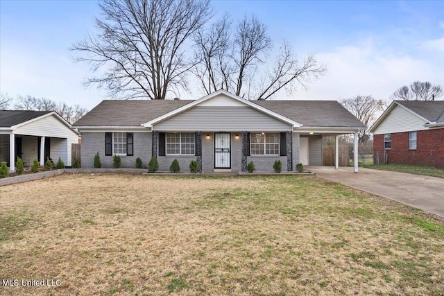 ranch-style house with a carport, a front lawn, concrete driveway, and brick siding