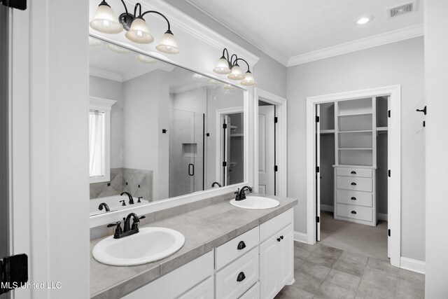 full bath with a spacious closet, a sink, visible vents, and a stall shower