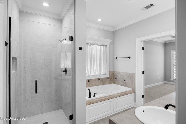 bathroom with a sink, a shower stall, visible vents, ornamental molding, and a bath