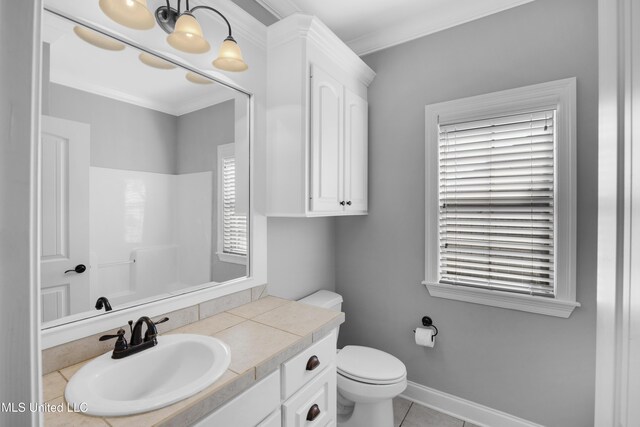 full bathroom with ornamental molding, a wealth of natural light, and vanity