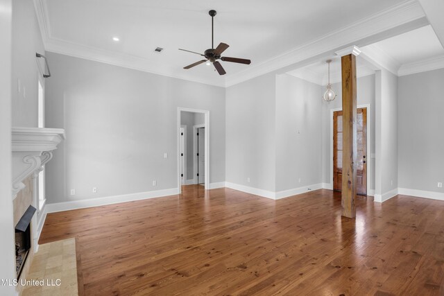 unfurnished living room with ceiling fan, a fireplace with flush hearth, hardwood / wood-style flooring, and visible vents