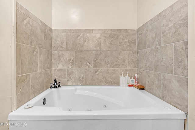 231 Hickory Ln, Batesville, MS 38606 - full bathroom with a tub with jets and tile walls