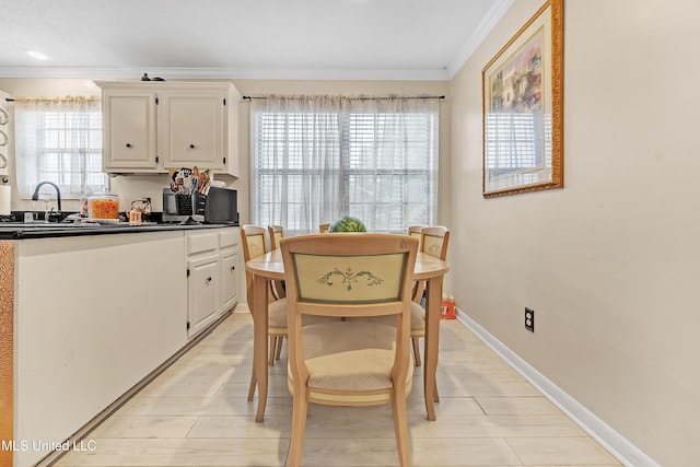 231 Hickory Ln, Batesville, MS 38606 - dining room with crown molding, healthy amount of natural light, and baseboards