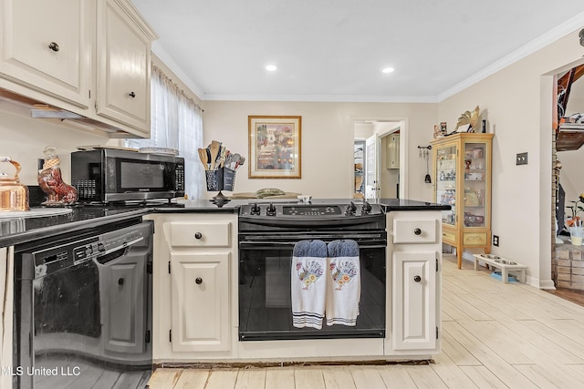 231 Hickory Ln, Batesville, MS 38606 - kitchen with black appliances, a peninsula, dark countertops, light wood finished floors, and ornamental molding