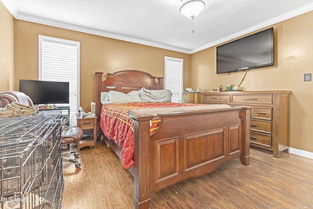 231 Hickory Ln, Batesville, MS 38606 - bedroom with wood finished floors, crown molding, and baseboards