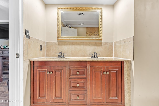 231 Hickory Ln, Batesville, MS 38606 - bathroom featuring double vanity and tile walls
