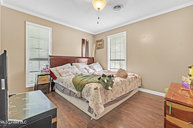 231 Hickory Ln, Batesville, MS 38606 - bedroom featuring crown molding, dark wood finished floors, and baseboards