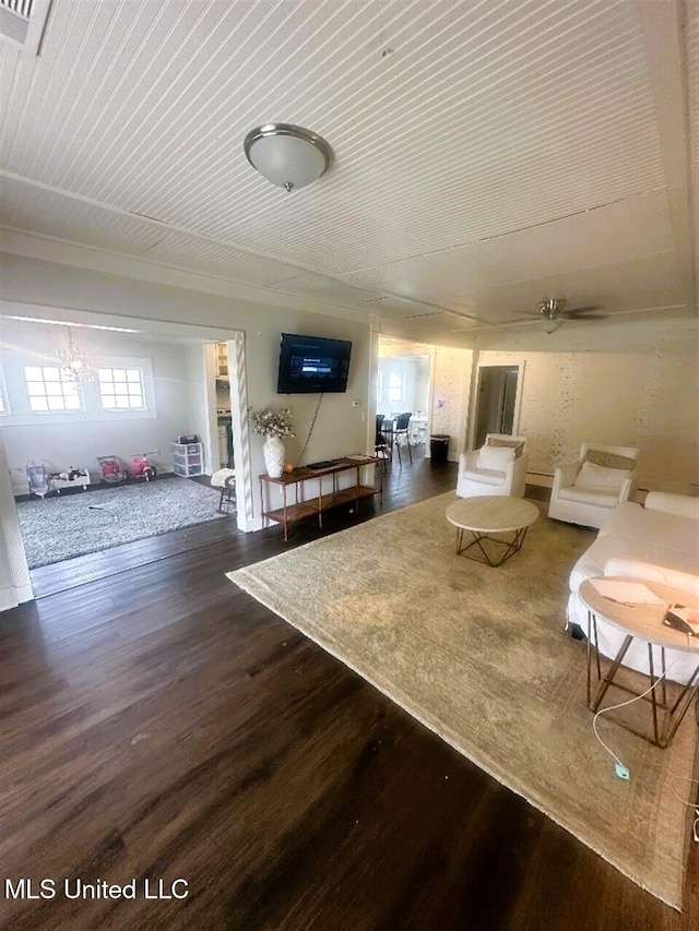 living room featuring dark hardwood / wood-style floors and ceiling fan