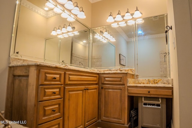 full bathroom with ornamental molding and vanity