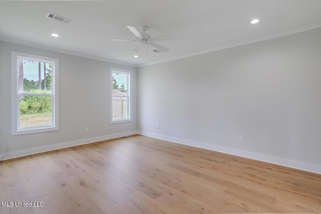 unfurnished room with crown molding, light wood-type flooring, and ceiling fan