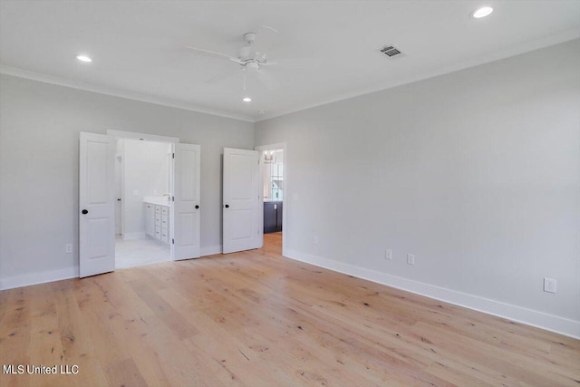 unfurnished bedroom with ceiling fan, ornamental molding, light wood-type flooring, and ensuite bath