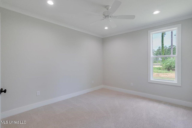 unfurnished room featuring ornamental molding, carpet floors, and ceiling fan