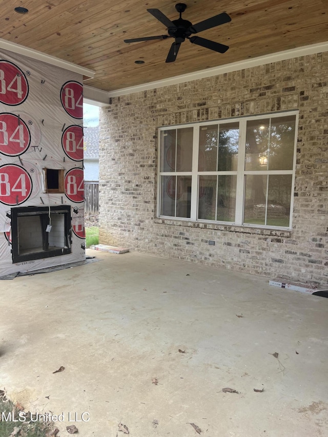 view of patio featuring ceiling fan