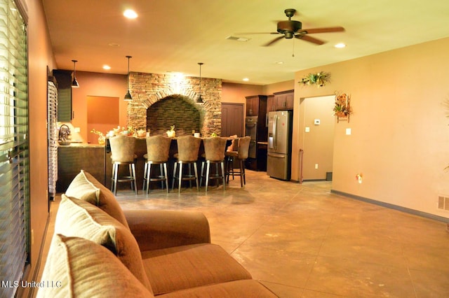 1088 S Red Banks Rd, Byhalia, MS 38611 - living room with ceiling fan, recessed lighting, light tile patterned floors, and baseboards