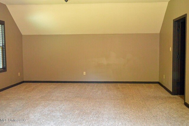 1088 S Red Banks Rd, Byhalia, MS 38611 - additional living space featuring lofted ceiling, light carpet, and baseboards