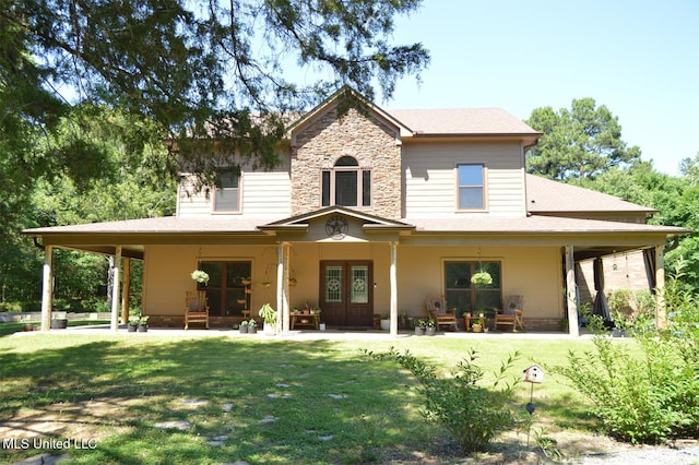 1088 S Red Banks Rd, Byhalia, MS 38611 - rear view of house with french doors, a lawn, stone siding, and a patio
