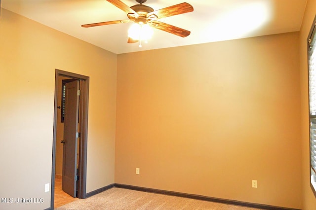 1088 S Red Banks Rd, Byhalia, MS 38611 - unfurnished room with ceiling fan, light colored carpet, and baseboards