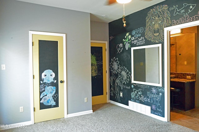 1088 S Red Banks Rd, Byhalia, MS 38611 - unfurnished bedroom with carpet floors and baseboards