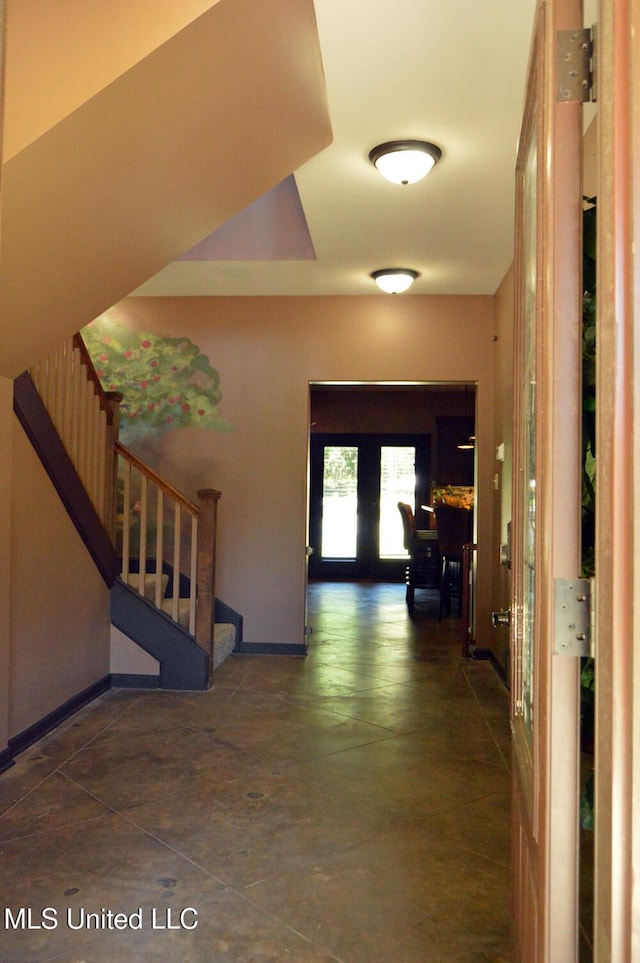 1088 S Red Banks Rd, Byhalia, MS 38611 - hall with stairway, baseboards, and concrete floors