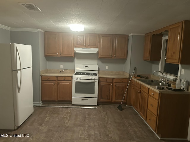 kitchen with white appliances, ornamental molding, and sink