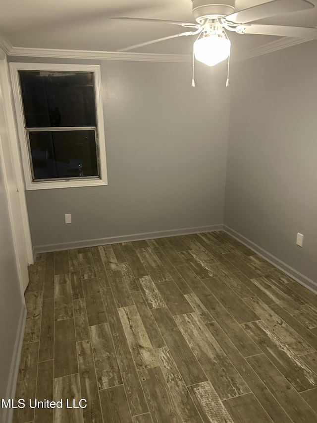 spare room with ceiling fan, crown molding, and dark hardwood / wood-style flooring