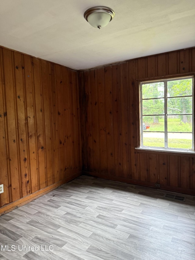 4189 Del Rosa Dr, Jackson, MS 39206 - empty room with light wood finished floors and wooden walls
