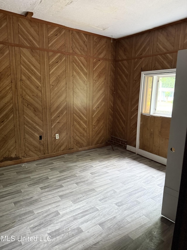 4189 Del Rosa Dr, Jackson, MS 39206 - spare room with wood finished floors and wood walls