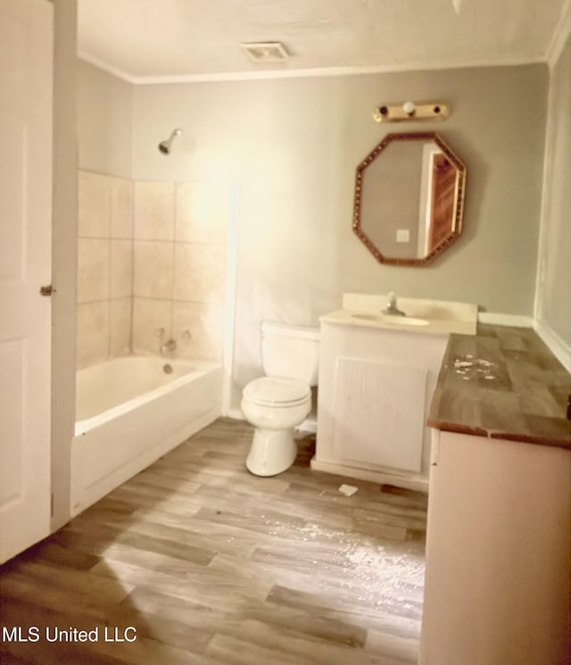 4189 Del Rosa Dr, Jackson, MS 39206 - bathroom with vanity, wood finished floors, shower / bath combination, and ornamental molding