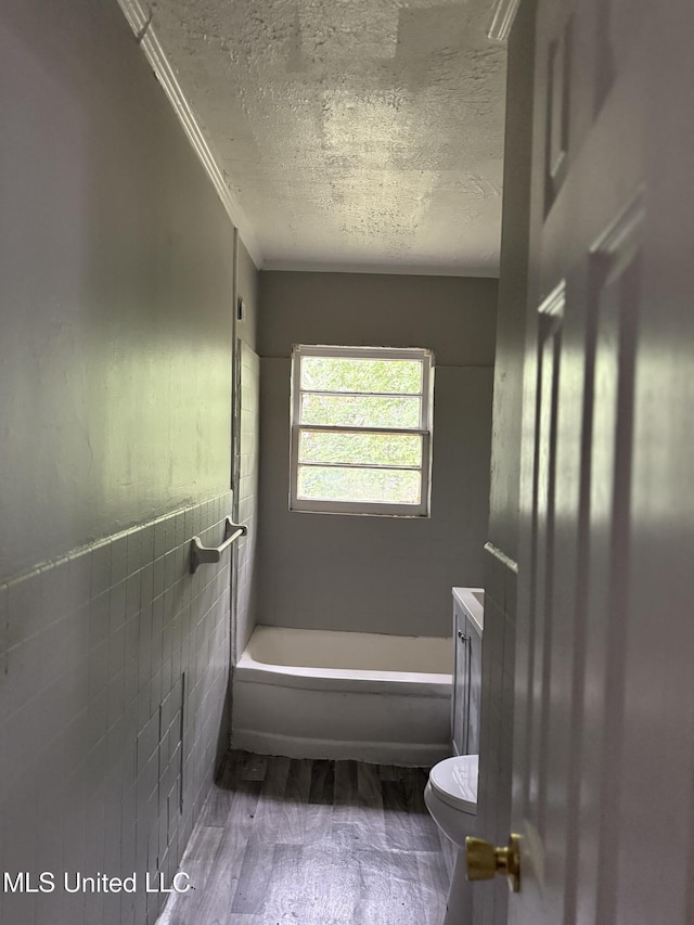 4189 Del Rosa Dr, Jackson, MS 39206 - full bath featuring a textured ceiling, a bathtub, wood finished floors, vanity, and crown molding