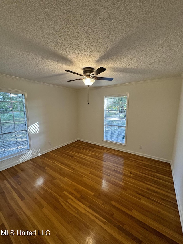 unfurnished room with dark wood-type flooring, ceiling fan, and a textured ceiling