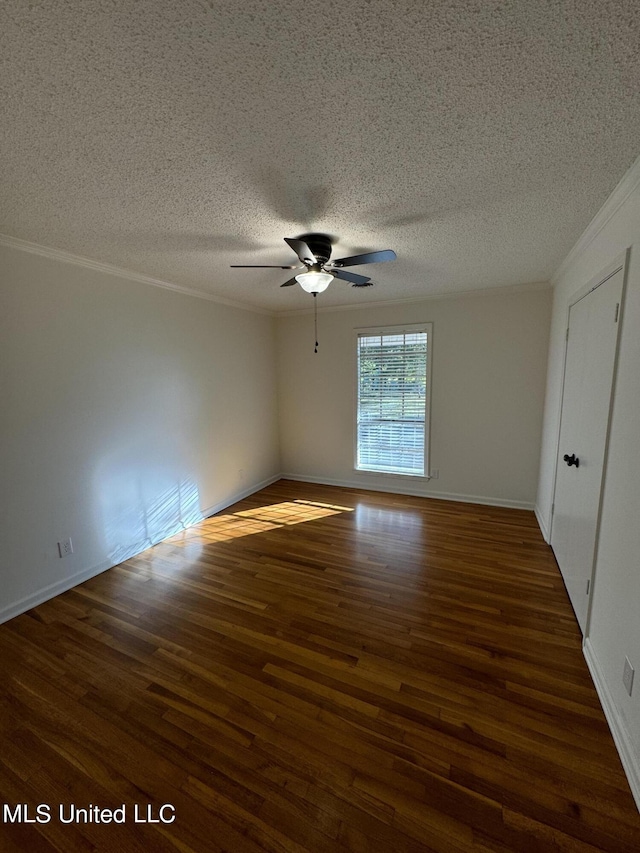 spare room with ornamental molding, a textured ceiling, ceiling fan, and dark hardwood / wood-style flooring