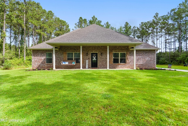 3112 Eagle Ridge Rd, Vancleave, MS 39565 - view of front of property with a shingled roof, a front yard, and brick siding