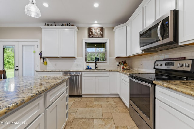 3112 Eagle Ridge Rd, Vancleave, MS 39565 - kitchen featuring stainless steel appliances, recessed lighting, stone tile floors, tasteful backsplash, and white cabinetry
