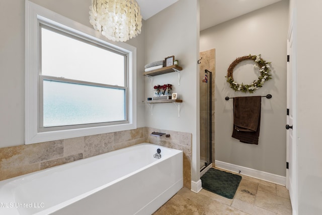 3112 Eagle Ridge Rd, Vancleave, MS 39565 - full bathroom featuring a bath, a chandelier, and a stall shower