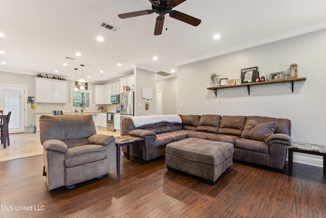 3112 Eagle Ridge Rd, Vancleave, MS 39565 - living area with ornamental molding, ceiling fan, recessed lighting, and dark wood-style flooring