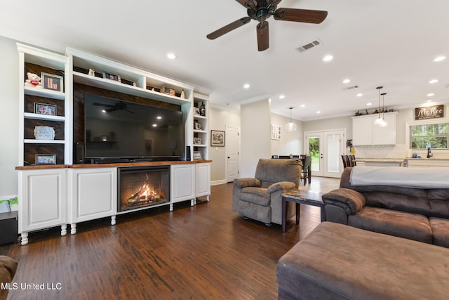 3112 Eagle Ridge Rd, Vancleave, MS 39565 - living area with a ceiling fan, ornamental molding, dark wood-type flooring, and recessed lighting