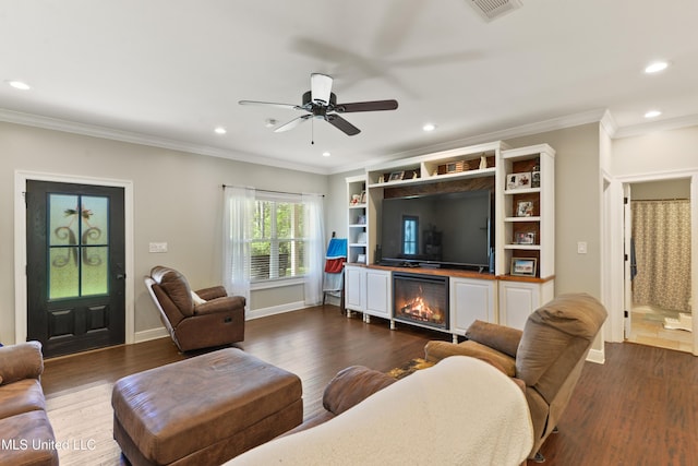 3112 Eagle Ridge Rd, Vancleave, MS 39565 - living area with dark wood finished floors, recessed lighting, a fireplace, crown molding, and a ceiling fan