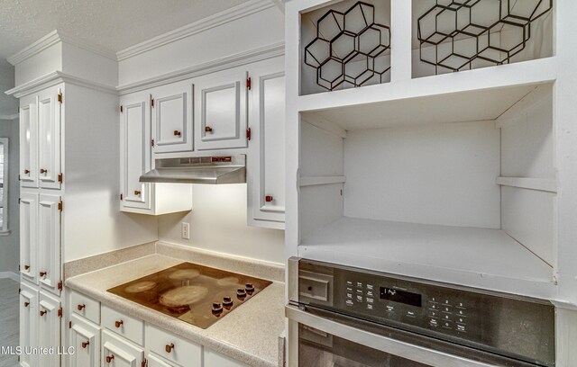 118 Bellegrove Blvd, Brandon, MS 39047 - kitchen with crown molding, oven, black electric stovetop, under cabinet range hood, and white cabinets