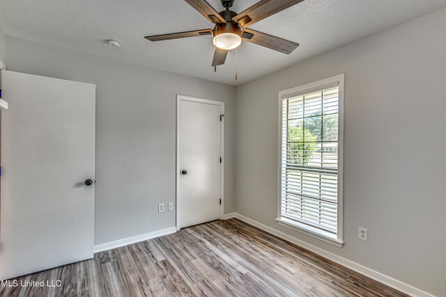 118 Bellegrove Blvd, Brandon, MS 39047 - empty room with baseboards, ceiling fan, and wood finished floors